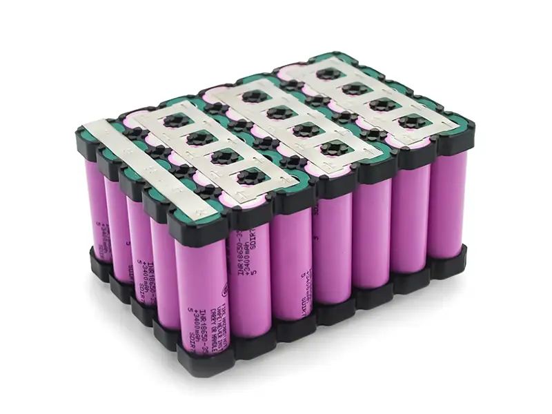 Custom lithium-ion battery pack built from purple 18650 cells with nickel strips and plastic holders