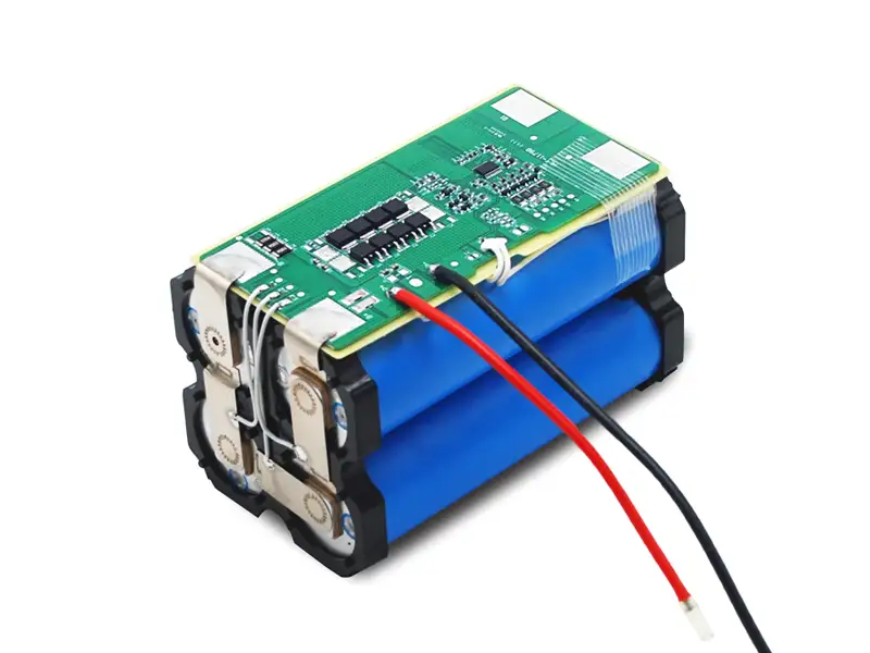 Custom battery pack with blue cylindrical cells, green BMS protection board and red and black wires
