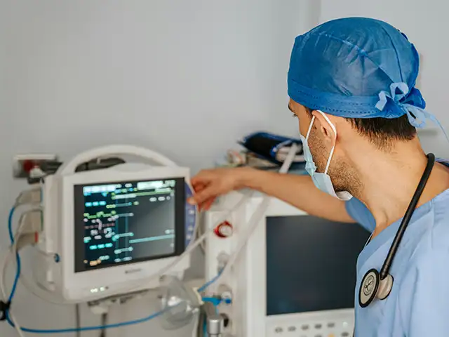 Medical Device Battery Applications Medical staff adjusting a patient monitor, a medical device battery application